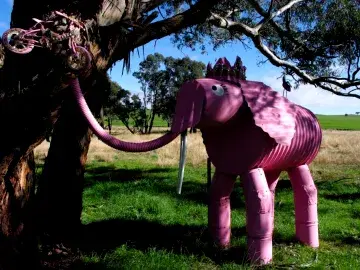 Pink elephant sculpture riding a bike - towardsustainabilitywiththreekids.blogspot.com (CC BY-NC-ND 3.0)