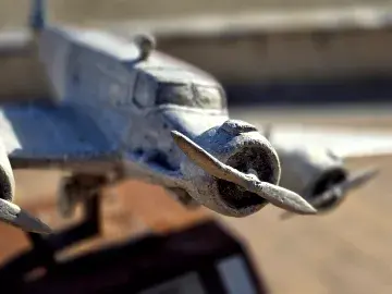 Close up view of a metal aircraft sculpture from the front engine