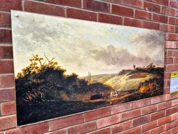 Painting from the national gallery of Scotland on a brick wall