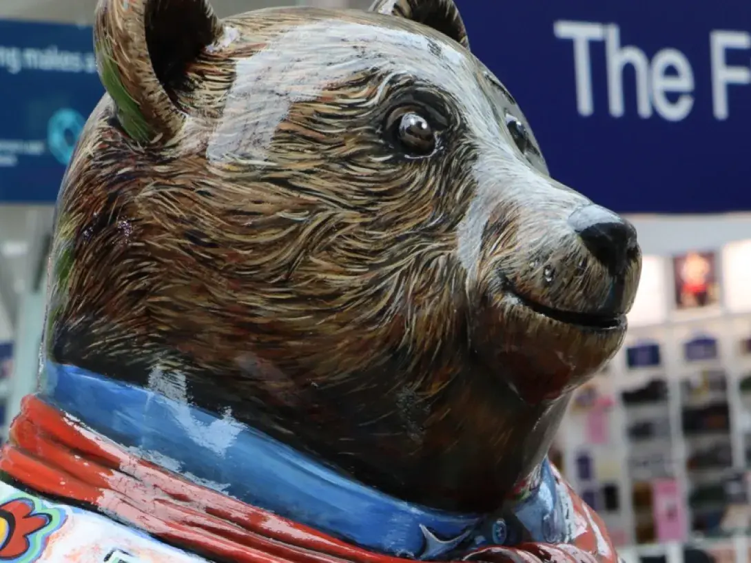 Close up face of a decorated bear sculpture - chswbearhunt.org © (used with permission)