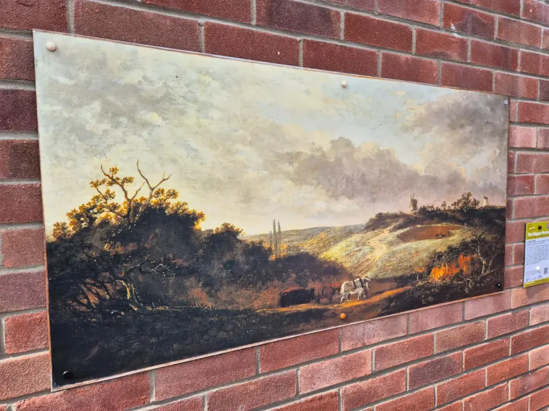 Painting from the national gallery of Scotland on a brick wall