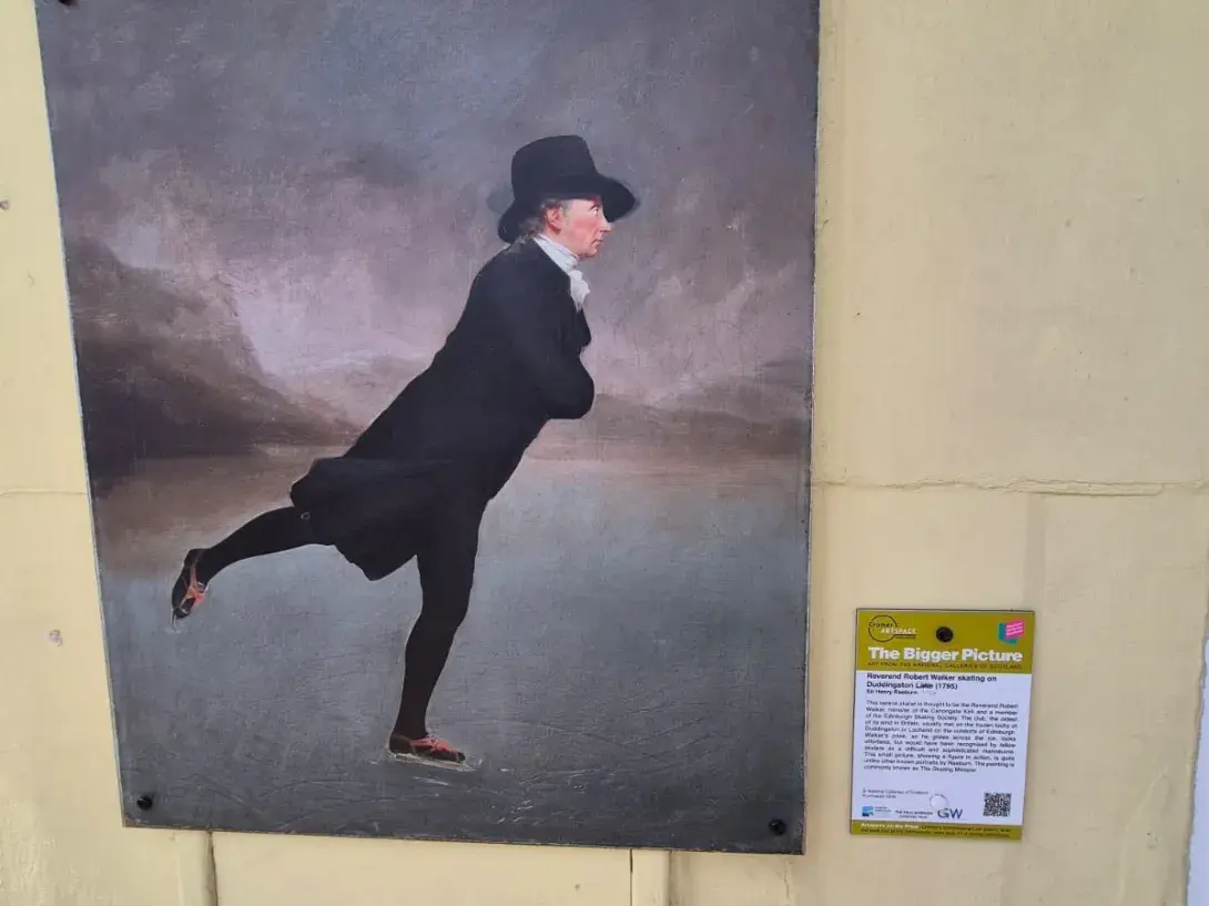 Skater painting on a wall